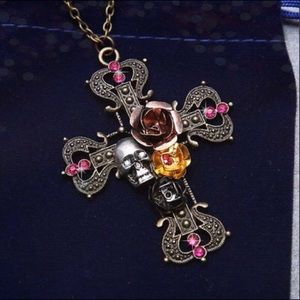 Antique finished silver cross encrusted in jewels.